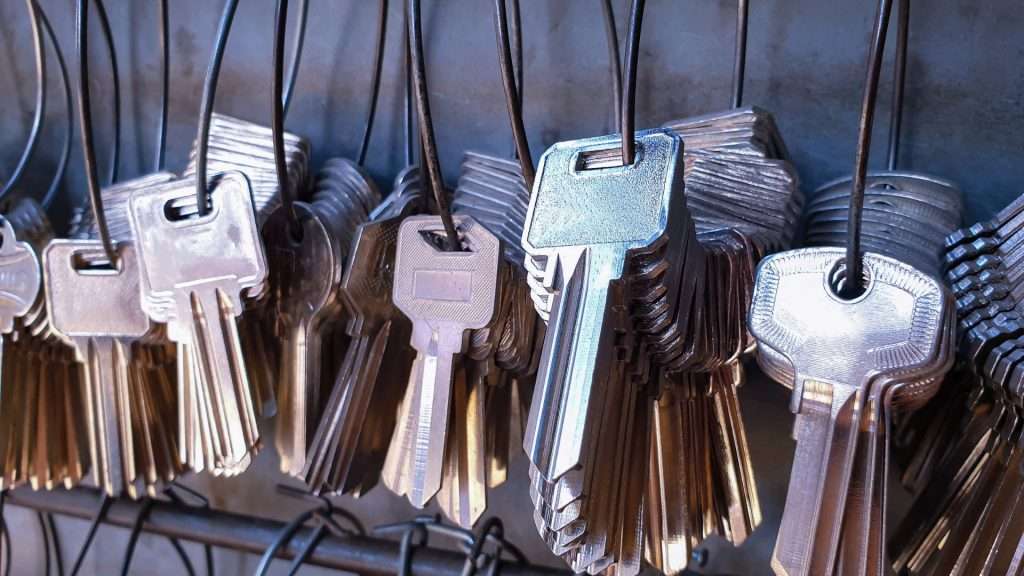 A bunch of keys hanging on the wall